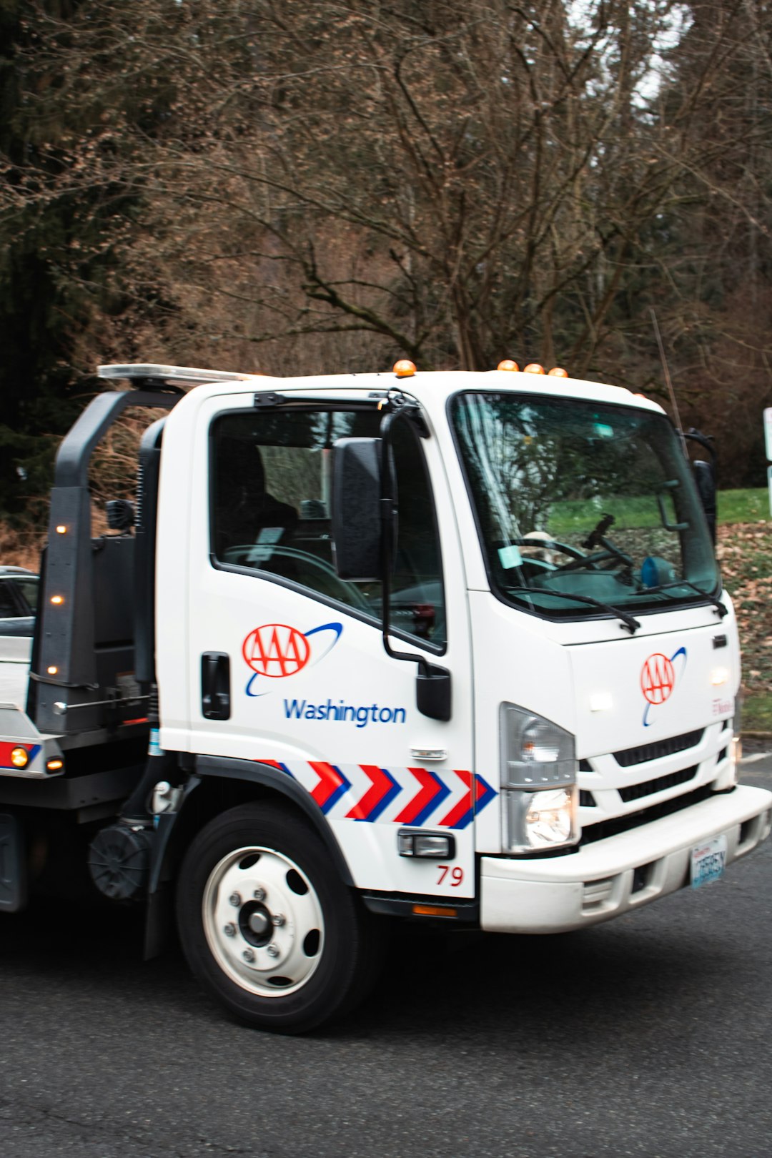 A white AAA tow truck.